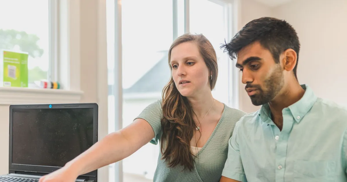Canadian couple planning a large purchase on a laptop after a $5000 loan guaranteed approval