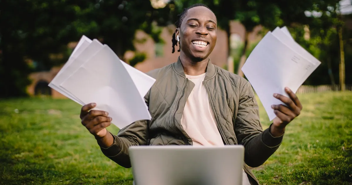 Relieved Canadian man reading an approval for guaranteed installment loans on his phone at home
