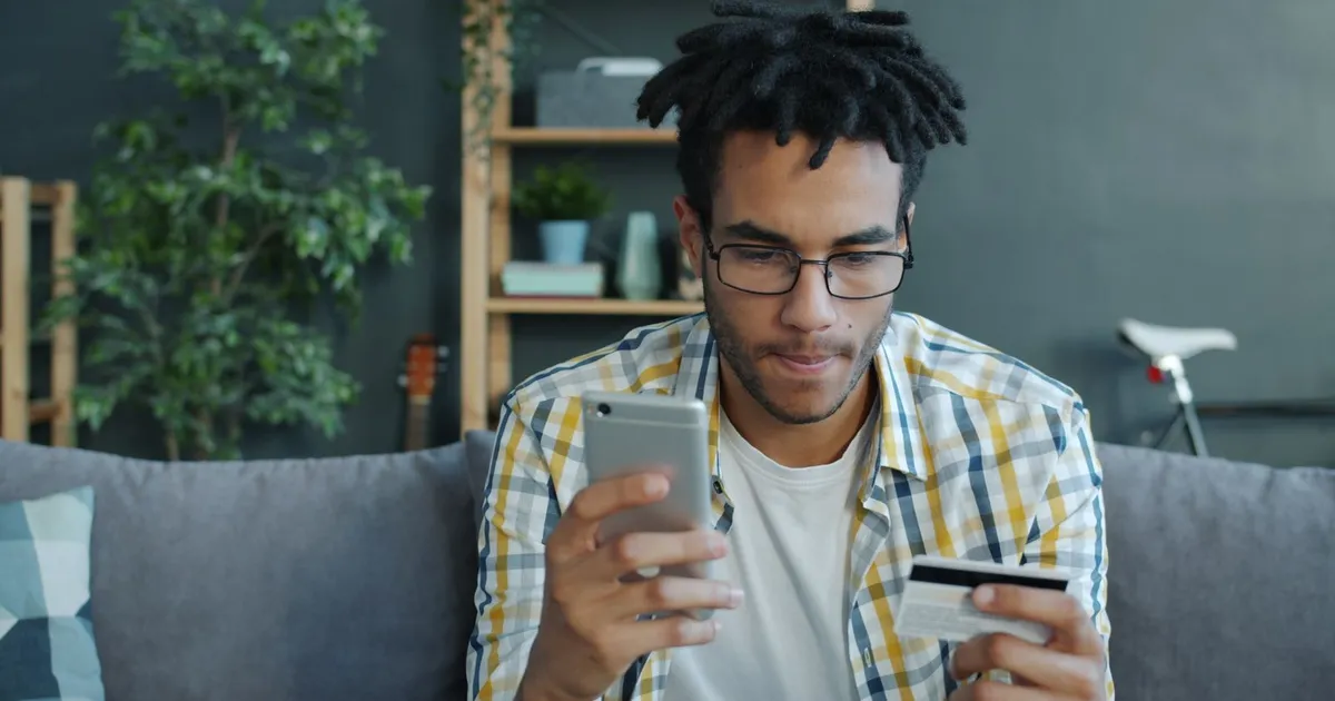 Person confirming income through a phone banking app for installment loans no credit check
